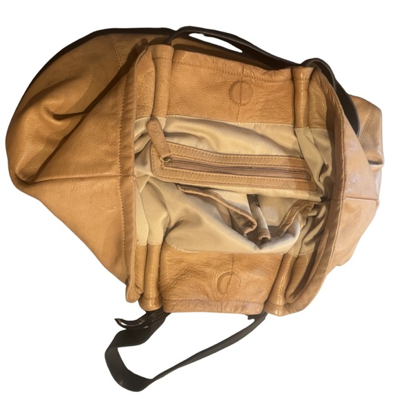 Makes the look without even trying. The exquisitely slouchy  Soft Pebbled Tan Leather Slouchy Hobo Bucket Shoulder Bag Charm Slouchy brown
